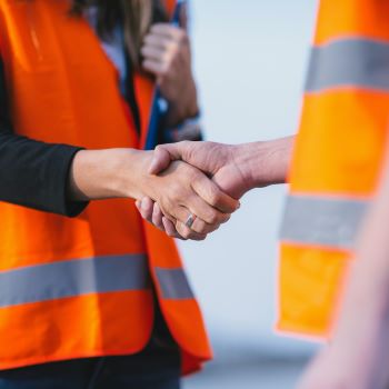 Two engineers shaking hands